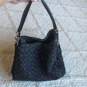 Black and grey logo Coach purse. Excellent condition!